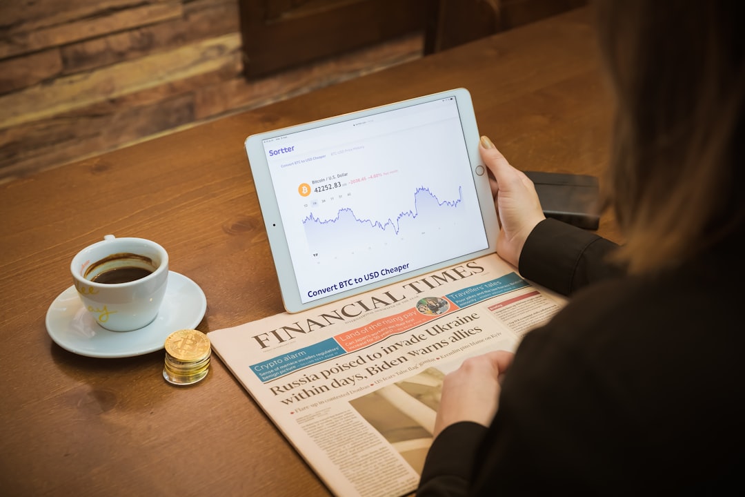 home-services-03 Drinking coffee in a coffee shop checking Bitcoin chart with Financial Times, from the United Kingdom, aside.